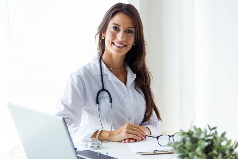 beautiful-young-female-doctor-looking-at-camera-in-the-office